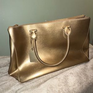 Gold Ralph Lauren hand bag.